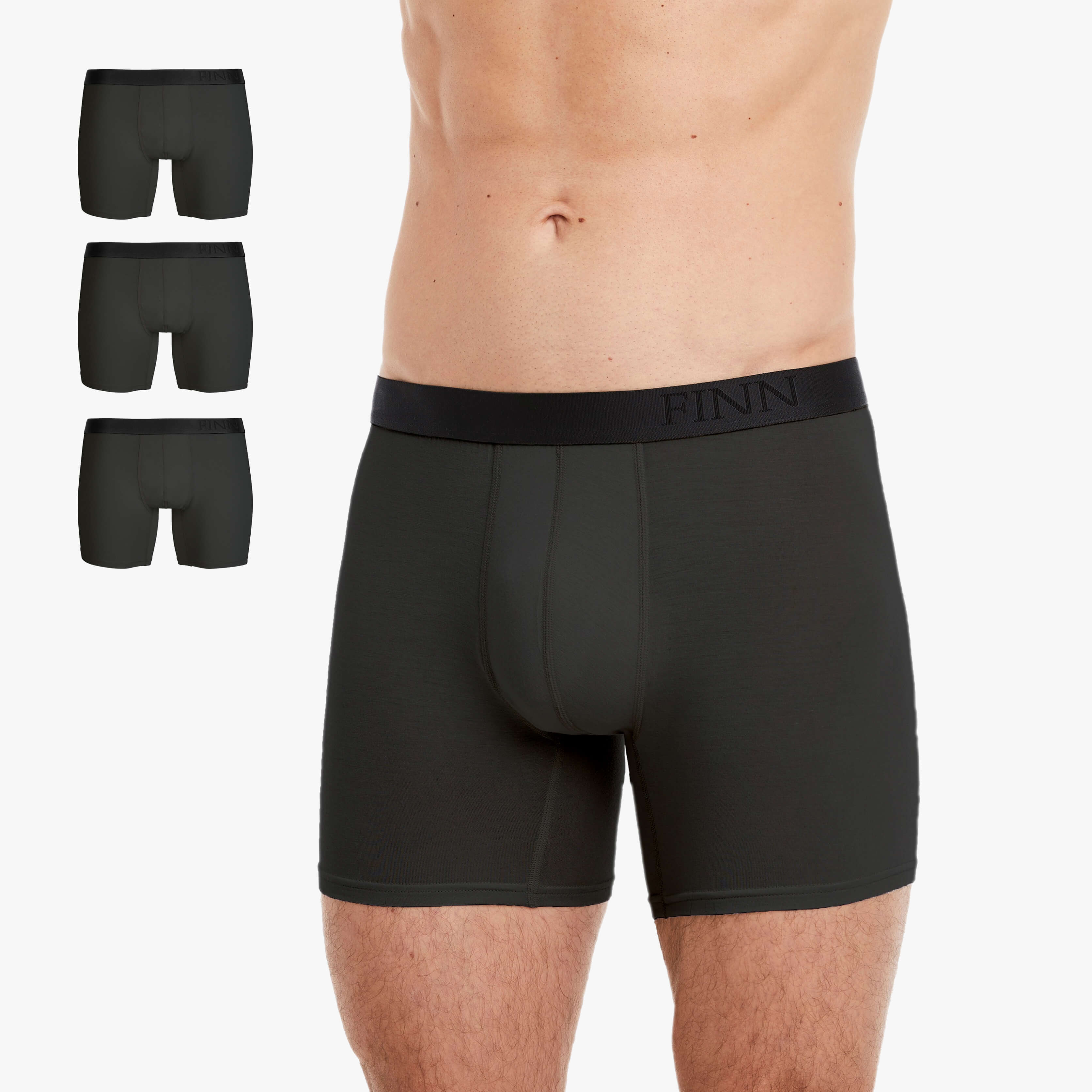 Mann trägt eng anliegende graue Boxershorts aus hochwertiger Baumwolle mit elastischem Bund und stilvoller Logo-Gravur. Atmungsaktiv, bequem und perfekt für den täglichen Komfort. #farbe_grau