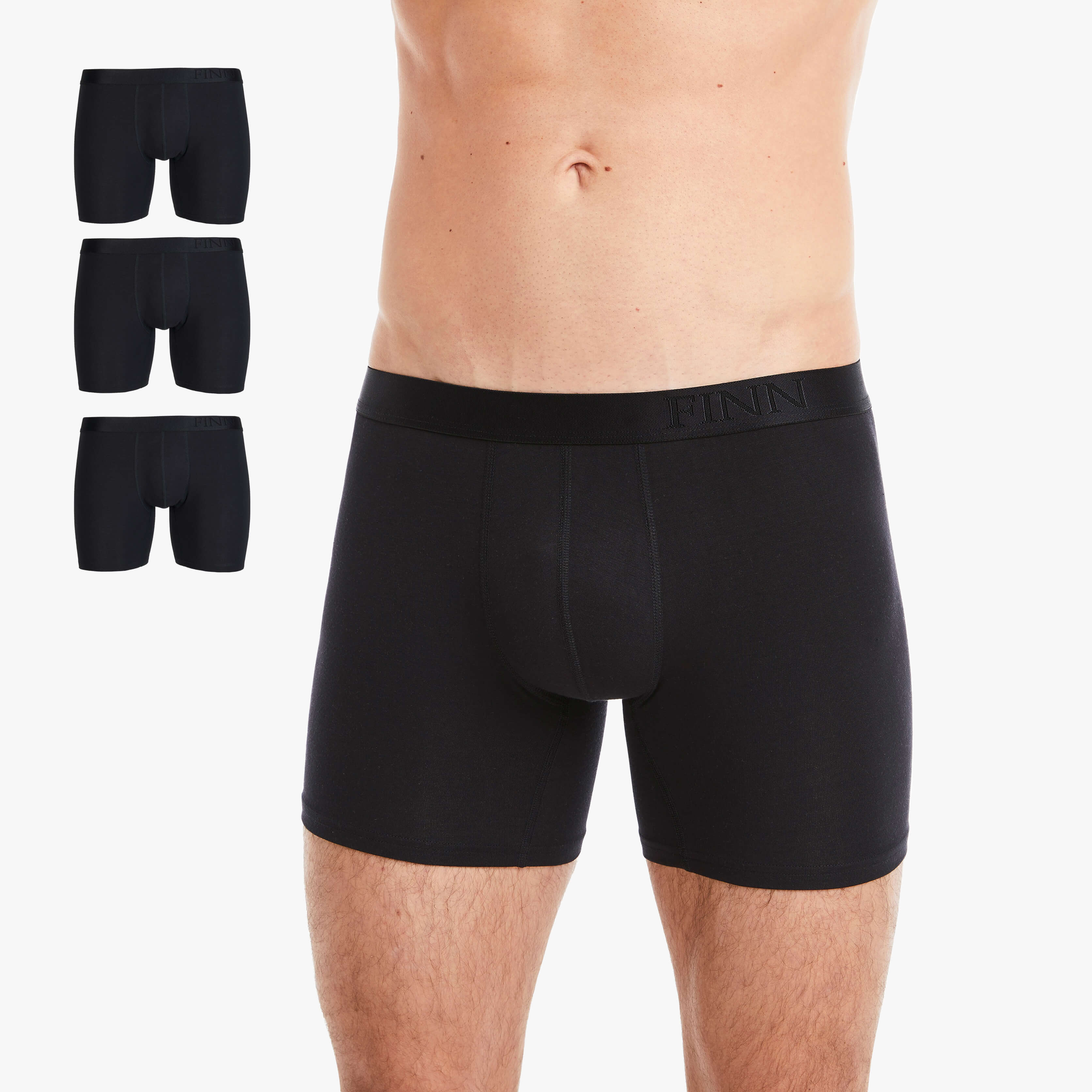 Mann trägt eng anliegende schwarze Boxershorts aus hochwertiger Baumwolle mit elastischem Bund und stilvoller Logo-Gravur. Atmungsaktiv, bequem und perfekt für den täglichen Komfort. #farbe_schwarz